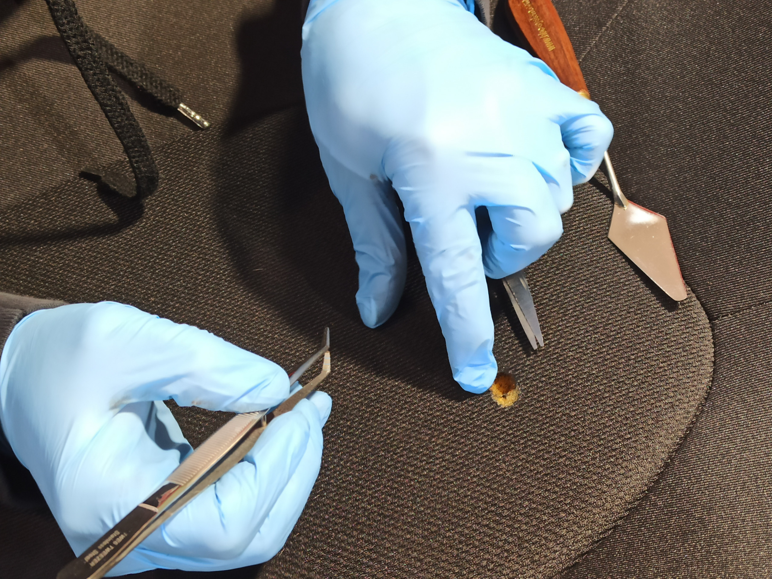 Car interior repairs of a cigarette burn on a seat