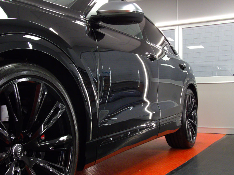 Nanotechnological treatment on a black Audi Q8