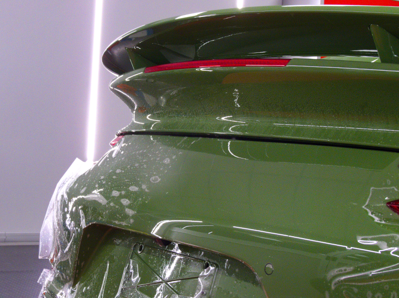 car protective films installament on a green porsche